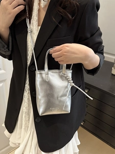 Chic silver metallic mini bucket bag with fashion bags logo and shoulder strap