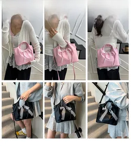 Detalles del bolso tipo cubo con lazo de encaje en colores rosa y negro elegantes