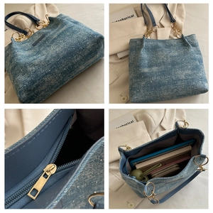 Macro details of blue denim tote bag showing sparkly sequins, gold chain, and interior pocket