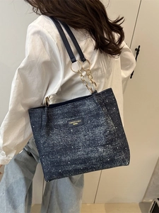 Retro denim-textured large tote bag with gold chain strap in dark blue finish