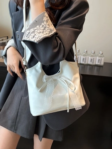Elegant cream white faux leather tote bag with large lace bow detail for women