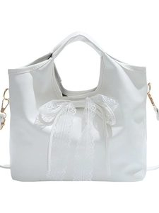 Elegant white PU leather tote bag featuring a large lace bow accent and gold hardware