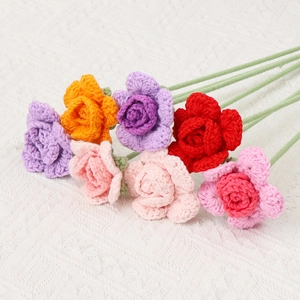 Handcrafted crochet rose bouquet with colorful knitted yarn flowers for home decoration