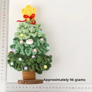 Detail of handmade crochet Christmas tree with colorful pompoms and ruler, weight approx. 96g