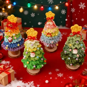 Handcrafted crochet Christmas tree miniatures with wooden bases and colorful ornaments