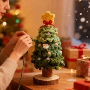 Detail of handmade crochet Christmas tree with mini Santa and wooden base decor