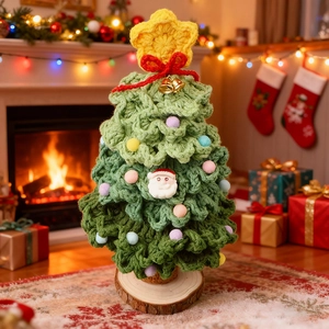 Handmade crochet Christmas tree with colorful pompoms and stars on a wooden base