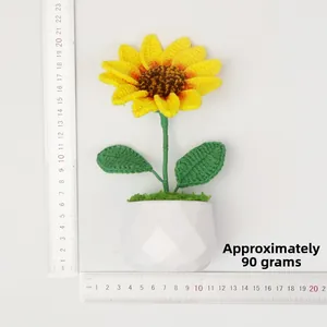 Handmade crochet sunflower potted plant in white geometric vase with scale for size