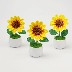 Three handmade crochet sunflower potted plants in white pots for creative home decor