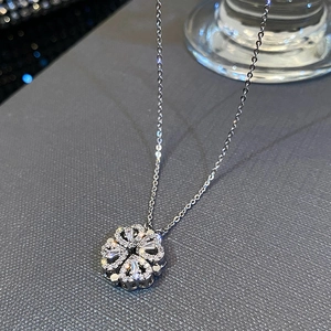 Folding four-leaf clover necklace with sparkling heart-shaped petals and silver chain