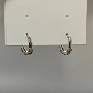 Chic 925 silver hoop earrings with shimmering cubic zirconia stones in a C-shaped design