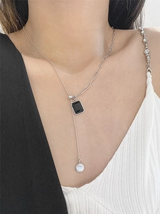 Detail of 925 silver fringe necklace with black zircon square pendant and adjustable chain