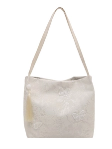 Elegant cream tote bag with 3D butterfly embroidery and silk tassel hanging vertically