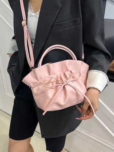 Pink pleated tote bag with bow detail for women, stylish crossbody shoulder handbag