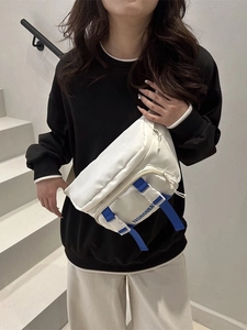 Minimalist white nylon crossbody chest bag with blue fashion straps for sports and casual wear