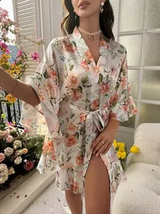 Close-up of floral print satin robe featuring elegant ruffles and a waist tie detail