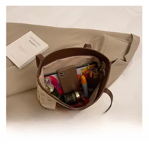 Interior view of large capacity vintage tote bag showing daily essentials storage space