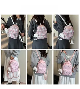Detailed view of two cute floral mini backpacks with cloud charms and durable zippers