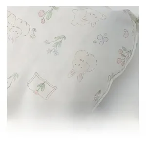 Detailed close-up of soft canvas fabric featuring cute bunny and floral pattern print