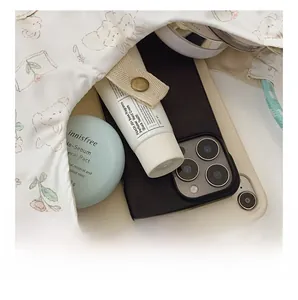 Interior view showing large capacity for tablet and cosmetics in cute floral tote bag