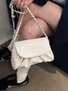 Chic white pleated cloud bag with silver chain strap for women, soft crossbody design