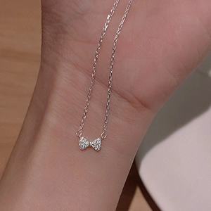 Sparkling S925 silver necklace with bow pendant featuring micropavé cubic zirconia stones