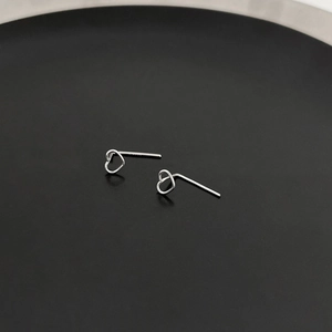 Minimalist S925 sterling silver hollow heart stud earrings for women in shiny silver finish