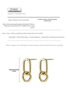 Detailed view of 15mm gold-plated double-loop geometric stud earrings with polished finish