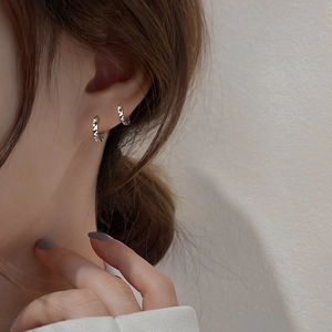 Minimalist geometric rhombic silver hoop earrings shown on model for a trendy daily look