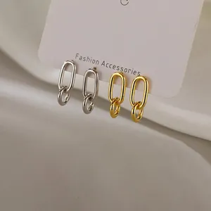 Minimalist geometric double oval link drop earrings set in gold and silver finish