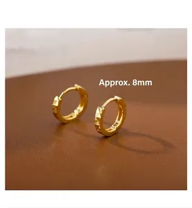 Detail of 18K gold S925 silver geometric huggie earrings showing the 8mm inner diameter