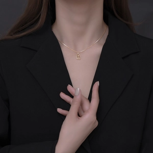 Elegant 925 silver gold-plated rose flower necklace pendant on a model wearing black