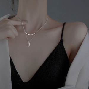Elegant S925 sterling silver layered necklace with curved bar and diamond oval pendant