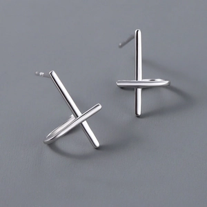Minimalist silver cross stud earrings for men and women with polished metallic finish