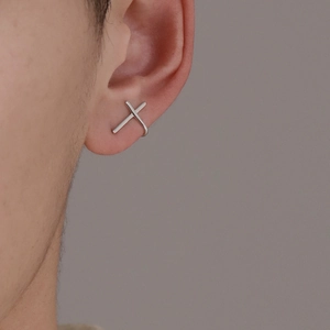 Minimalist silver crisscross ear cuff for men and women with a sleek polished finish