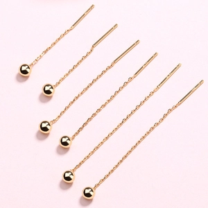 Detailed view of S925 sterling silver ball drop earrings with polished gold finish