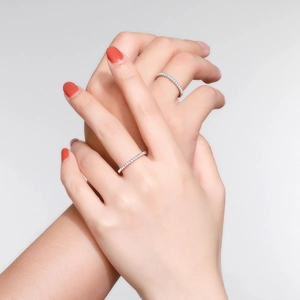 Minimalist S925 sterling silver eternity bands featuring pavé set sparkling moissanite