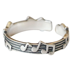 Vintage S925 sterling silver open ring featuring music notes and staff engraving