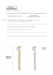 Detail of elegant 30mm long drop earrings with pearl stud and cubic zirconia accents