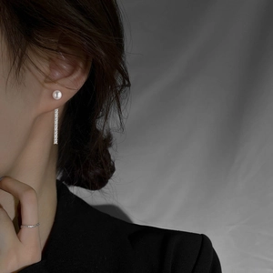 Elegant pearl stud earrings with long silver tassel and sparkling cubic zirconia dangles