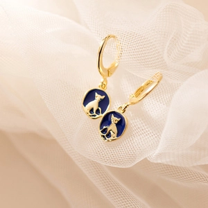 S925 silver cat earrings with blue enamel oval pendants on a soft fabric background