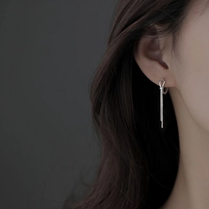Elegant S925 sterling silver knotted tassel earrings shown on model for women