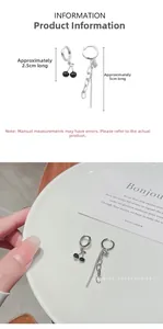 Detailed view of asymmetric cherry earrings set with size measurements in centimeters