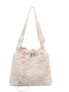 Minimalist white canvas drawstring tote bag with colorful wave embroidery patterns