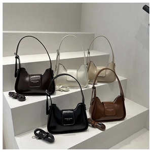 Detail showing five colors of leather crescent shoulder bags with adjustable straps