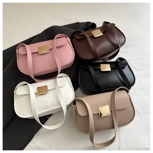 Flat lay of minimalist leather crossbody bags in five colors with golden buckles