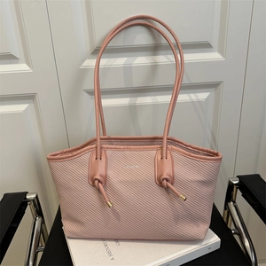 Pink woven oil wax leather tote bag with knotted long shoulder straps and metallic detail