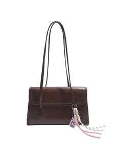 Dark brown minimalist faux leather underarm bag with cute pink woven keychain