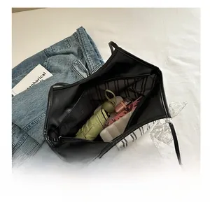 Internal view of striped tote bag showing large capacity for umbrella and wallet