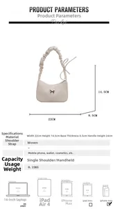 Detail view of woven texture cream handbag with silver butterfly charm and size dimensions